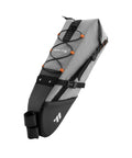 Large Capacity Waterproof Bike Seat Bag For Road And Mountain Rides Bikepacking Saddle Wedge Bag With Bungee Cord shown vertically.