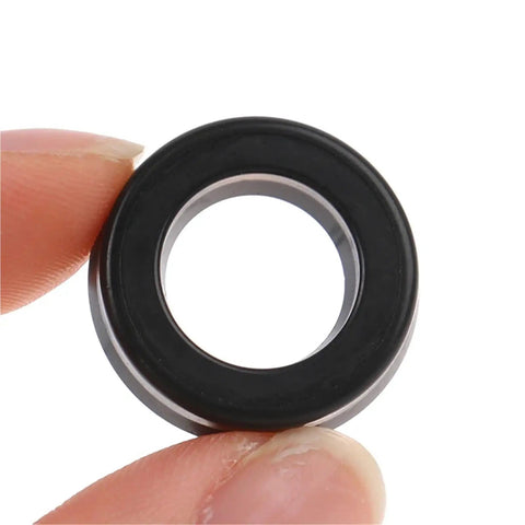 Three Piece Portable Cleaning Machine High Pressure Pump Head O Ring Set With 12x20x5mm And 12x20x5.3mm Rubber Seals, black rubber ring held by fingers