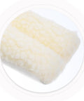 Close-up of fluffy white door stopper fabric texture, showing soft material for home and office, anti-collision bumper.