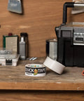 Max Strength Duct Tape Beast Mode Heavy Duty Hold With Waterproof Backing 1.88 Inch X 35 Yards White on workbench.