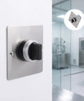 Built Like A Tank Stainless Steel Three Position Selector Switch Panel For Heavy Duty Industrial Machinery Control And Elevator Maintenance With Plug And Play Flush Mount Design on a wall with a black rotary dial.