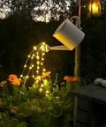 Solar String Lights 16 Feet 50 LEDs Warm White Two Pack Outdoor Fairy Lights illuminating flowers at night