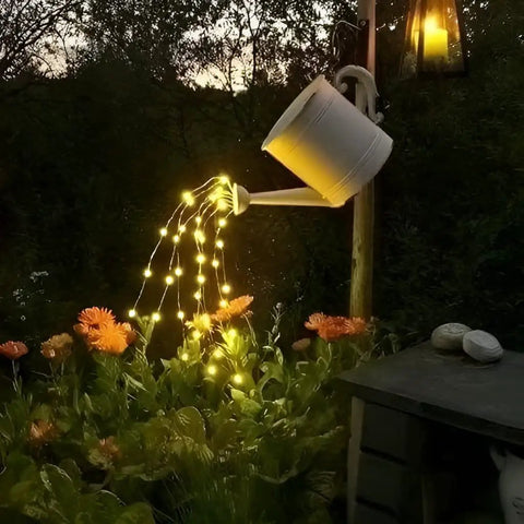 Solar String Lights 16 Feet 50 LEDs Warm White Two Pack Outdoor Fairy Lights illuminating flowers at night