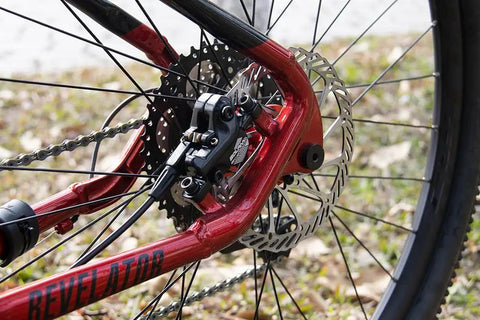Close-up of Beefy Hydraulic Disc Brake Set for MTB Fat Bikes and EBikes, showing two-piston system with PM adapter.