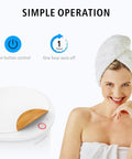 Woman smiling with towel wrapped hair next to Bucket Style Towel Warmer Ultra Large Capacity 450W For Bathroom ETL Certified FCC Approved Auto Shut Off Fits Up To Two 40x70 Towels Blankets And Bathrobes Cozy Warmth For The Whole Fam.