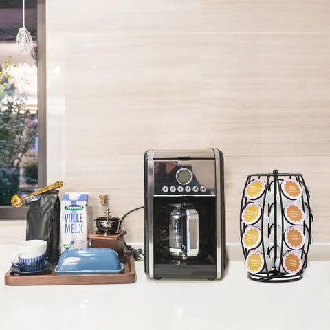 Rotating K Cup Holder Carousel For Countertop Holds 20 Coffee Pods Coffee Pod Organizer Stand No Fuss Pod Label Display Black Kitchen Accessory For Quick Pod Picks shown beside a coffee maker on a countertop