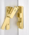 Close-up of Heavy Duty Gold 90 Degree Barn Door Lock With Flip Gate Latch And Dual Secure Mounting for strong security.