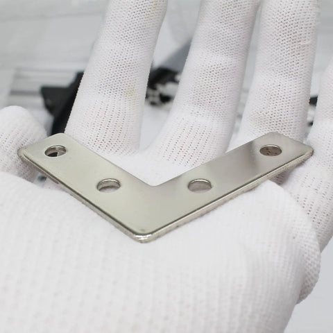 Ten Sets Of 2020 Stainless Steel T Slot Corner Brackets L Shape Joint Plates visible on gloved hand