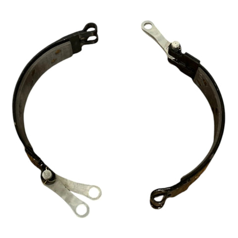 Brake band assembly for Case IH tractors, black steel with silver mounting lugs, front view