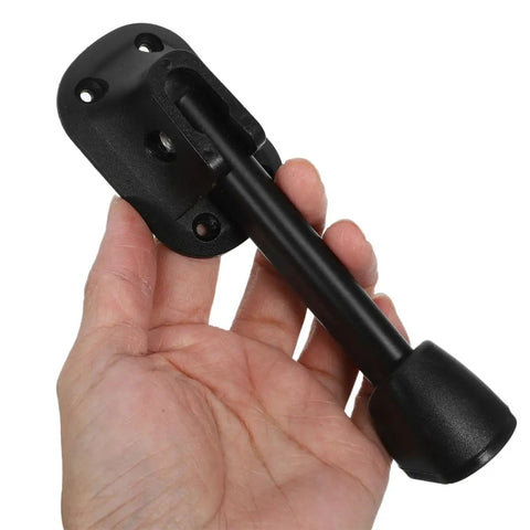 Hand holding black metal leg from Two Pack Foldable Iron Table Legs For Coffee Table Black Metal Furniture Hardware With Stable Support And Modern Sleek Look For Small Apartments And Home Offices.