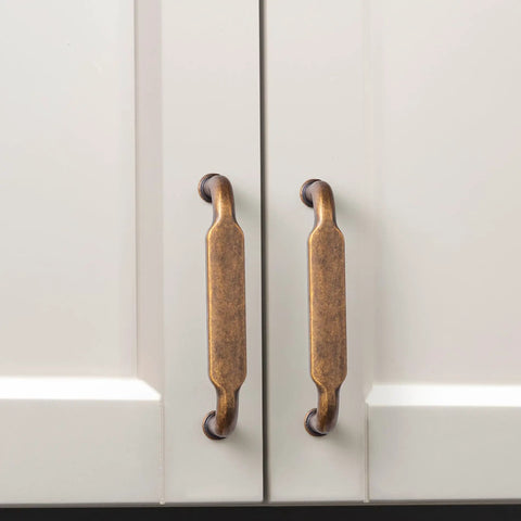 Antique Brass Zinc Alloy Cabinet Pulls 12 Pack Three And Three Quarters Inch Hole Centers Drawer Handles for kitchen cabinets.