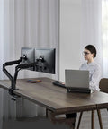 Game Changing Dual Monitor Stand With Smooth Gas Spring Lift Fits 17 To 32 Inch Displays offers ergonomic dual monitor setup with sleek dark grey aluminum.