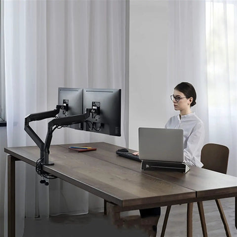 Game Changing Dual Monitor Stand With Smooth Gas Spring Lift Fits 17 To 32 Inch Displays offers ergonomic dual monitor setup with sleek dark grey aluminum.