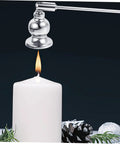 Christmas Metal Candle Fire Extinguisher Cap With Long Handle extinguishing a tealight, sleek silver design, elegant and functional.