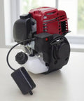 Ready To Mount Gas Powered Replacement Engine For Lawn Mowers And Small Machinery With Hassle Free Swap And Durable Black Housing, showing engine with red cover and fuel tank.