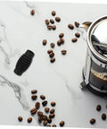 Insulation Sleeve For Coffee Makers Heat Resistant Steam Wand Guard next to coffee beans and French press on marble surface