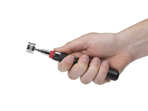 Hand holding 8-Lb Lift Capacity Telescoping Magnetic Pickup Tool With Extendable Shaft Shielding Collar And Nonslip Grip For Lifting Metal