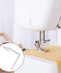 Installed Honbay quilting guide bar on a white household sewing machine; metal silver bar beside presser foot.