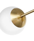 Close-up of Celestia 2-Light Wall Sconce in matte brass with frosted glass shade for a modern glam vibe and cozy glow