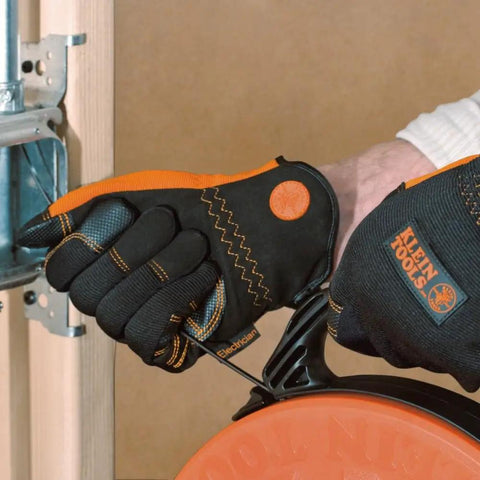 Close-up of person using Electrician Gloves Large with slip resistant palm and fingers, extended cuff, reinforced thumb base