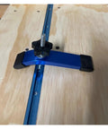Close-up of a Four Pack T Track Hold Down Clamps 160mm curved aluminum quick acting clamps on wood CNC workbench