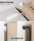 6 Foot 3 Outlet Extension Cord Two Pack Built For Real Life Use, white cord plugged behind furniture for space saving.