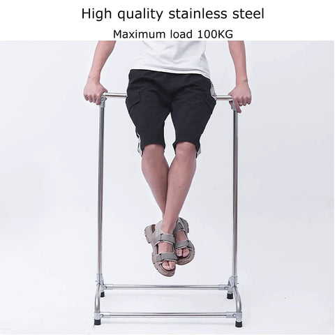 Stainless Steel Broom And Mop Organizer Rack With Five Racks And Six Hooks, Heavy Duty Floor Mounted Mop Holder supporting a person