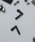 10 Pcs M10 Quick Release Locking Nuts Featuring Smooth Black Lever Handles And Vibration Resistant Zinc Alloy Construction For Tough As Nails Machine Tool And Jig Fixture Clamping, angled view on gray background.