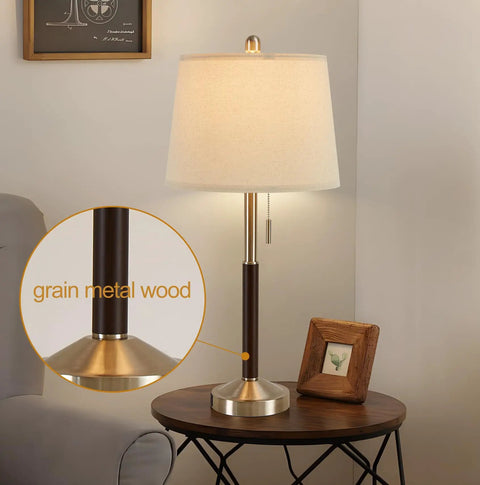 Table lamp with beige shade and grain metal wood base on round wooden table, focus on detailed design, Set Of 2 Bedside Lamps With USB Quick Charge Ports 20W QC3.0 3 Way Dimmable Touch Lamps With Built-In Fairy Lights In Modern Glass Design For Nightstands And Living Rooms.
