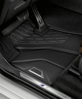 Close-up of installed All Weather Floor Mats For G05 X5 And G07 X7 SUV Set Of Two Front Mats Heavy Duty Rubber With Non Slip Backing