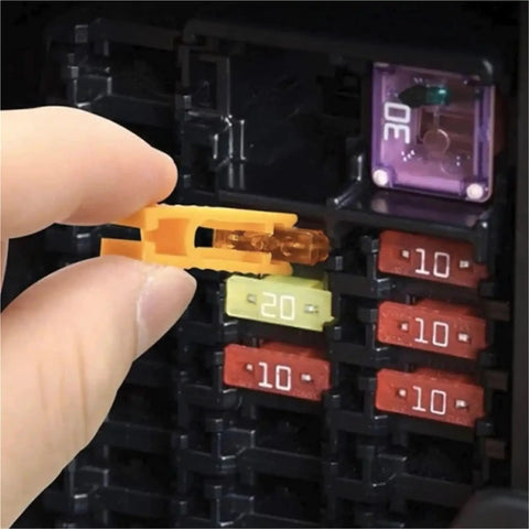 Close-up of hand using puller from Garage Must Have Car Fuse Kit 1200Pcs Assortment With 520 Standard Fuses 680 Premium Fuses Plus 1 Puller Zinc Case