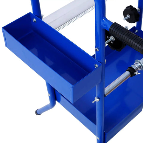 Close-up of Mobile 18 Inch Multi Roll Masking Paper Machine with storage trays and tape dispenser stand, blue.