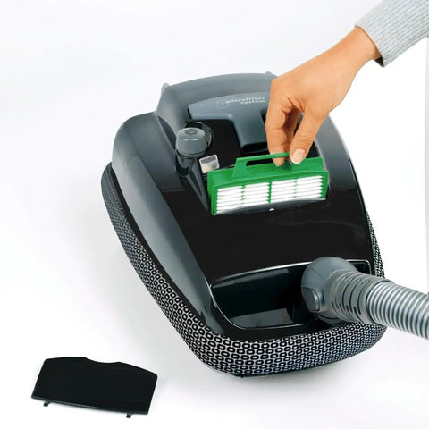Person installing filter from the K Series Vacuum Maintenance Kit With Eight Filter Bags, Exhaust Filter And Pre Motor Microfilter For A Deep Clean, Pro Grade Replacement Set For Airbelt K Series Vacuums And Cleaners