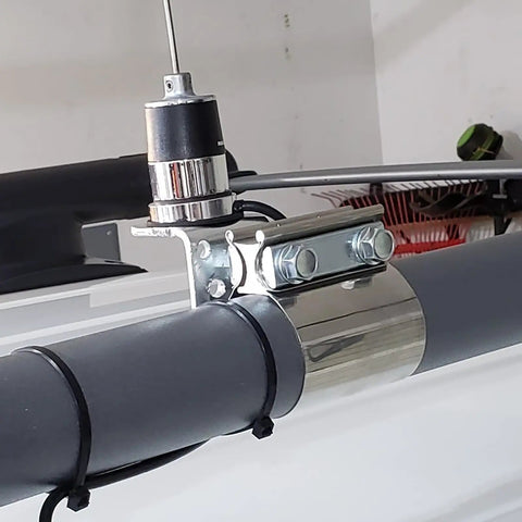 Close-up of a Four Pack 2.5 Inch Stainless Steel Butt Joint Exhaust Clamp Band Sleeve attached securely on a pipe.