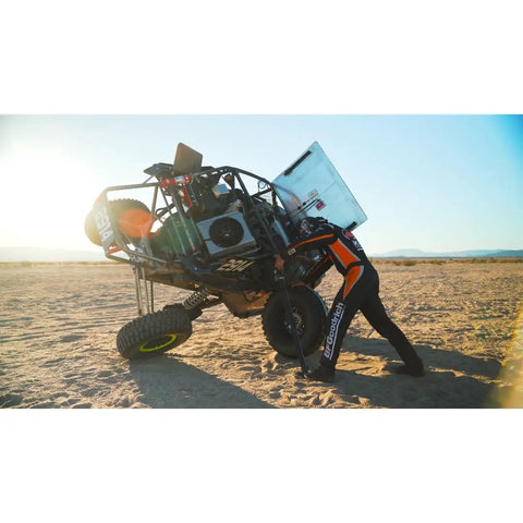 Off-road vehicle lifted using Electric High Lift Off Road Jack With 2000 LB Lift Capacity, 14 Inch Lift, battery powered.