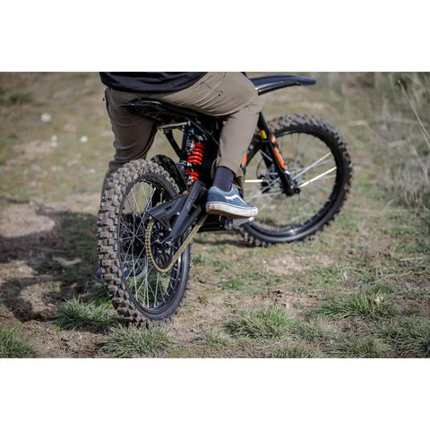 Rear Electric Dirt Bike Tire 80/90x19 Tube Type Fits Surron And Segway Talaria on bike in offroad terrain.
