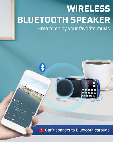 Bluetooth AM FM Portable Radio With Dual Speakers And Heavy Bass LED Flashlight on table with smartphone and cup