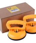 Two Pack 5 Inch Suction Cup Lifting Tool Set With 110 Lb Vertical Lift And 130 Lb Horizontal Pull For Glass Tiles Mirrors And Smooth Surfaces Beefed Up For Heavy Duty Home Improvement Projects Tile Replacement Glass Handling next to box