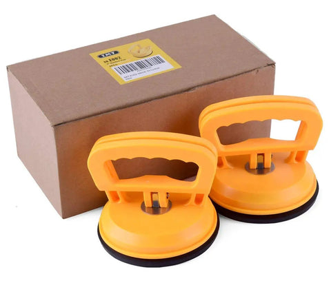 Two Pack 5 Inch Suction Cup Lifting Tool Set With 110 Lb Vertical Lift And 130 Lb Horizontal Pull For Glass Tiles Mirrors And Smooth Surfaces Beefed Up For Heavy Duty Home Improvement Projects Tile Replacement Glass Handling next to box
