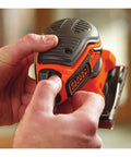 Hands holding Powerful Two Point Zero Amp Orbit Sander for finish work on wood, metal, and plastic with paddle switch visible.