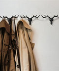 Rock Solid Heavy Duty Wall Hooks For Coats Jackets And Kitchen Towels Premium Zinc Mounting Hardware holding coats on a wall.