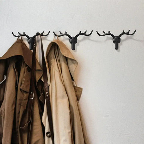 Rock Solid Heavy Duty Wall Hooks For Coats Jackets And Kitchen Towels Premium Zinc Mounting Hardware holding coats on a wall.