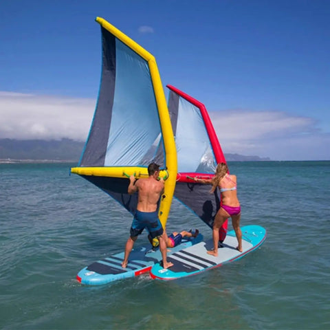 People using Inflatable Windsurfing Foil Kit With Tough As Nails Pro Grade Oxford Cloth And PVC Construction Waterproof Wear Resistant And Rust Proof Gear For Windsurfing Surfing Kitesurfing And Ski Surfing Water Sports Four Point Two Square on a paddleboard.