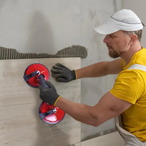 Man using Heavy Duty Vacuum Suction Cup With Double Claw Build For No Sweat Glass Tile And Windshield Handling to lift tile.