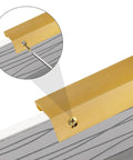 Close-up of brushed gold aluminum edge pull being installed on a drawer with a screw from 10 Pack Finger Edge Pull Handles 80mm Brushed Gold Aluminum Edge Pulls Right Angle Cabinet Hardware For Kitchen Doors And Drawers Two And A Half Inch Hole Spacing Budget-Friendly Includes Screws And Mini Screwdriver