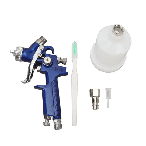 Top Shelf HVLP Gravity Feed Paint Sprayer With Sleek Aluminum Body And Point Oh Nozzle showing sprayer, cup, and cleaning tool.