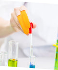 Person using 100 Pack Latex Protective Finger Sleeves for pipetting in a lab with colorful liquid measurements.