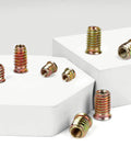 M8-1.25 Wood Threaded Inserts 25mm Long, 30 Pack With Hex Spanner, Zinc Plated Steel For Furniture And Woodworking Projects shown on display.