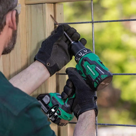 Person using 18V MultiVolt Cordless Drill And Driver Kit With Brushless Motor Half Inch Keyless Metal Chuck 620 Inch Pounds Torque Beast Power 22 Plus 1 Clutch Lightweight 2.8 Pounds Accepts 18V And MultiVolt Batteries Up To 8Ah Lifetime Tool Warranty on wooden fence.