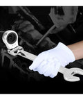 Gloved hand using a ratchet spanner set with socket tool kit, compact for tight spaces and high hardness work, shown in use.